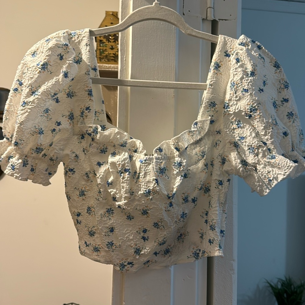 White floral top with puffy sleeves